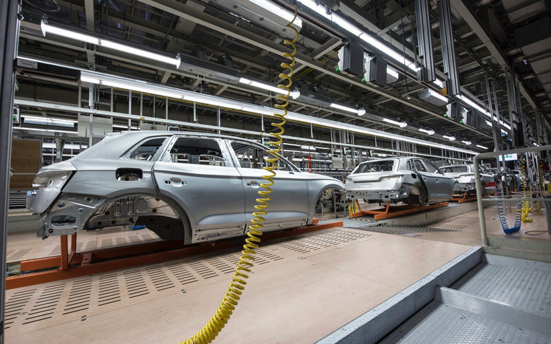 Cars are assembled in a factory