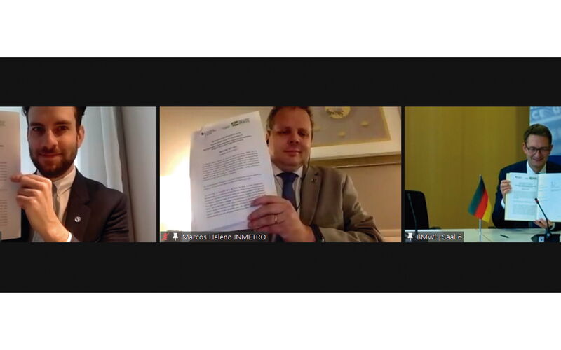 Screenshot of Geanluca Lorenzon (ME), Marcos Heleno (Inmetro) and Stefan Schnorr (BMWi) signing the work plan for 2021-2022.