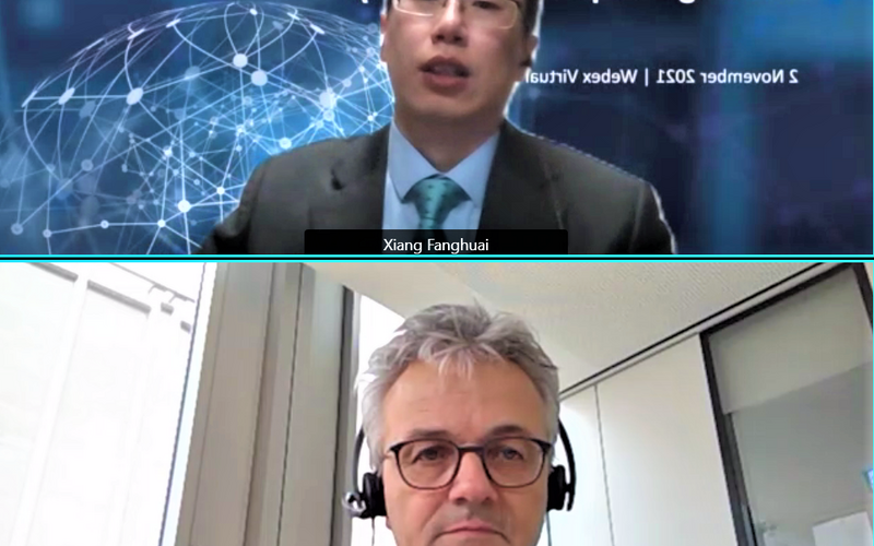 Xiang Fanghuai (SAMR) and Michael Stephan (DIN) speak at 8th annual meeting of the SWG Electromobility.